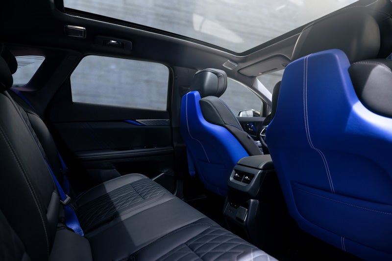 Back Seat View of the 2026 OPTIQ-V Blue Front Seats, Sun Roof, and Interior | Vaughn Automotive - Cadillac of Ottumwa in OTTUMWA IA